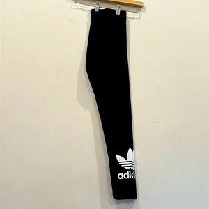 Adidas Blk Lycra mid rise leggings with Adidas logos on both lower legs Size S.